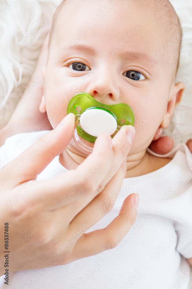 Cute newborn baby with a pacifier Cute newborn baby with a pacifier