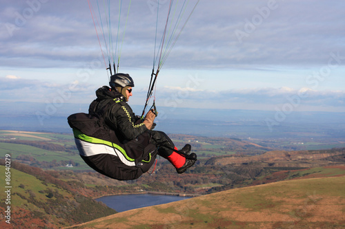 Fototapeta Naklejka Na Ścianę i Meble -  Paraglider above Dartmoor