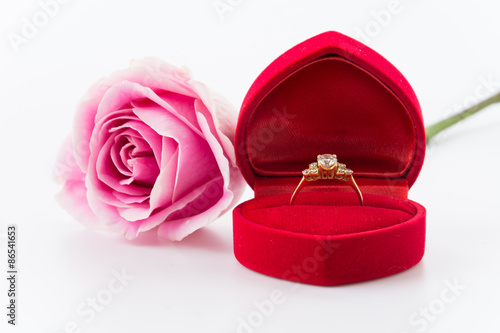 ring with white and pink rose on white background © topntp
