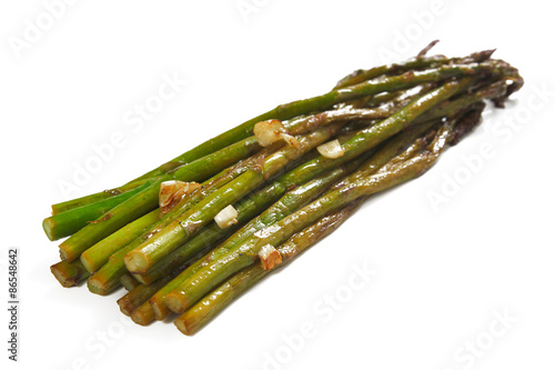 Roasted asparagus with garlic, isolated, shallow focus
