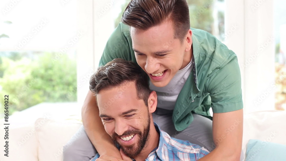 Gay couple relaxing on the couch Gay couple relaxing on the couch
