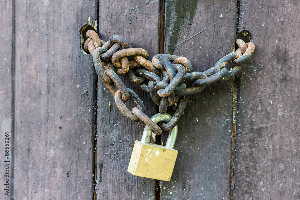 Old wooden door with Chain key lock Old wooden door with Chain key lock
