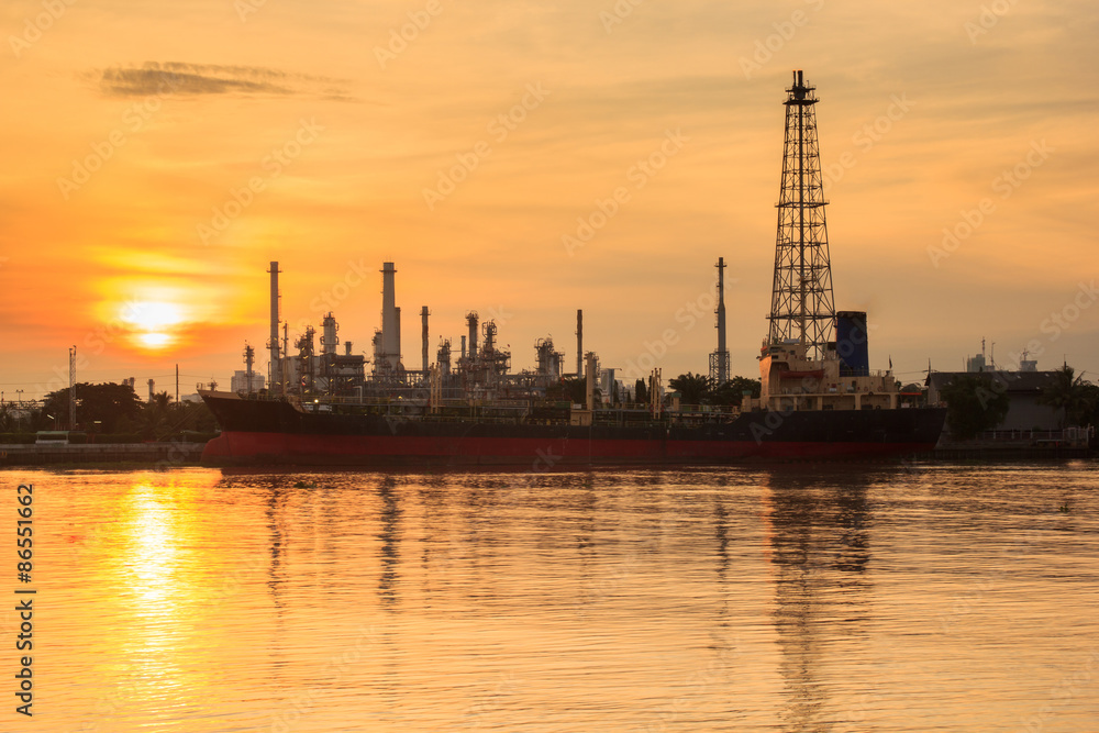 Oil refinery silhouette along the river at sunrise time (Bangkok, Thailand)
