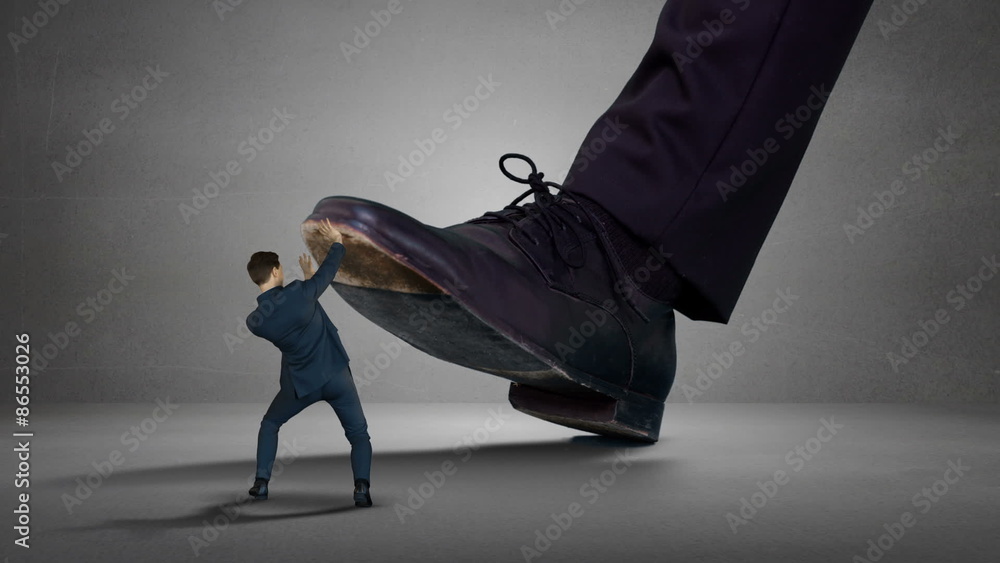 Shoes of boss trying to squash his employee