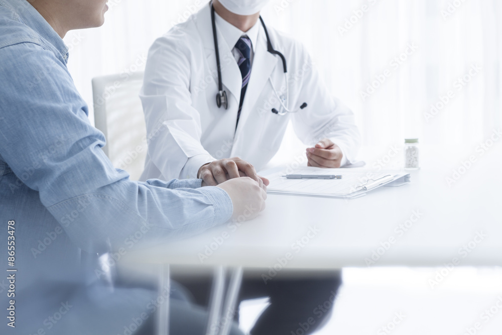 The doctor holds the hand of a patient The doctor holds the hand of a patient