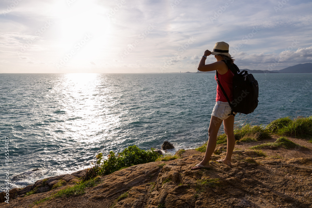 Traveler asia woman on sea cliff