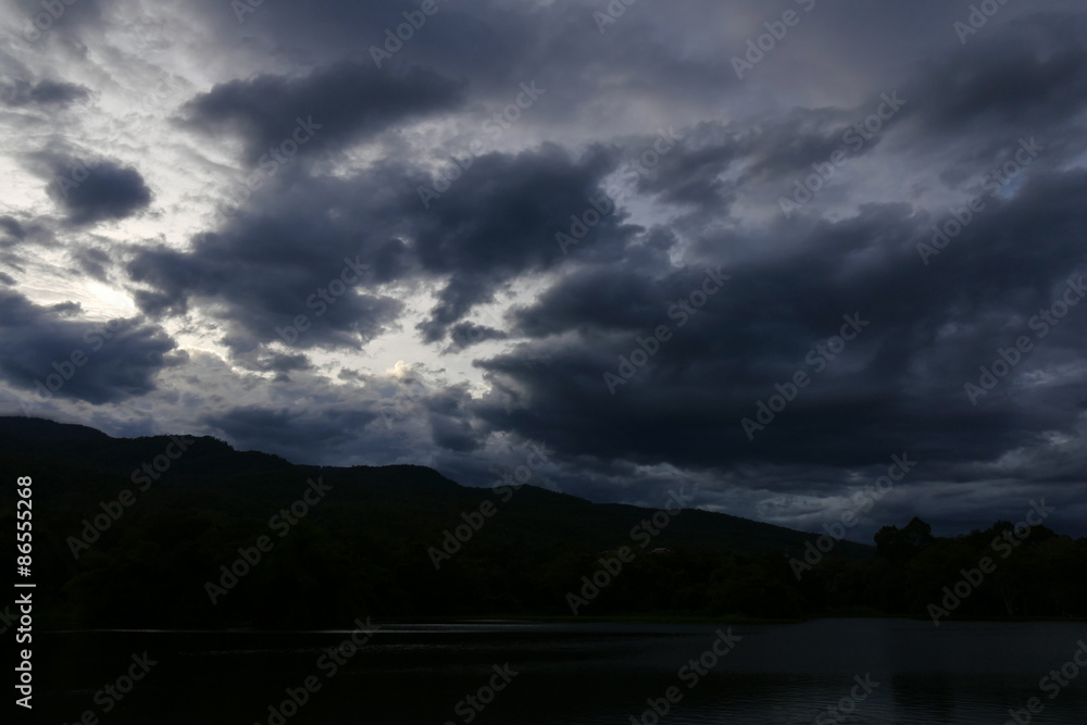 silhouette of mountain with view of cloud and sky at dusk