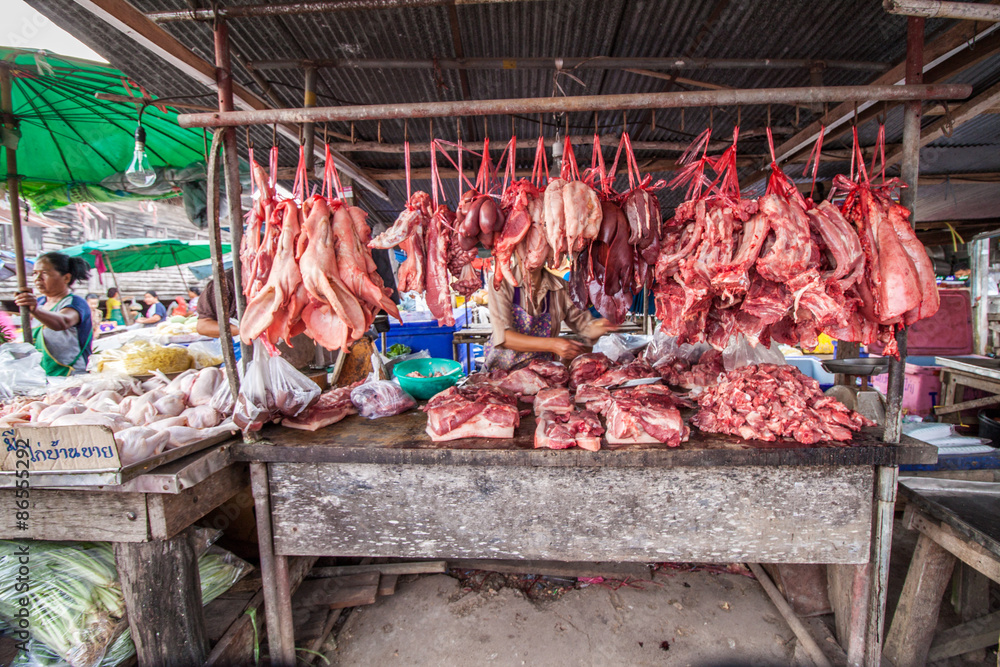  Hanging pork and meat at butcher shop stall