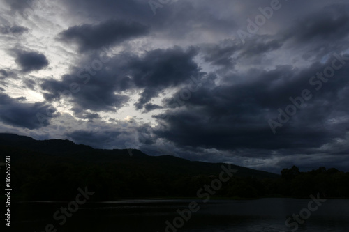 silhouette of mountain with view of cloud and sky at dusk