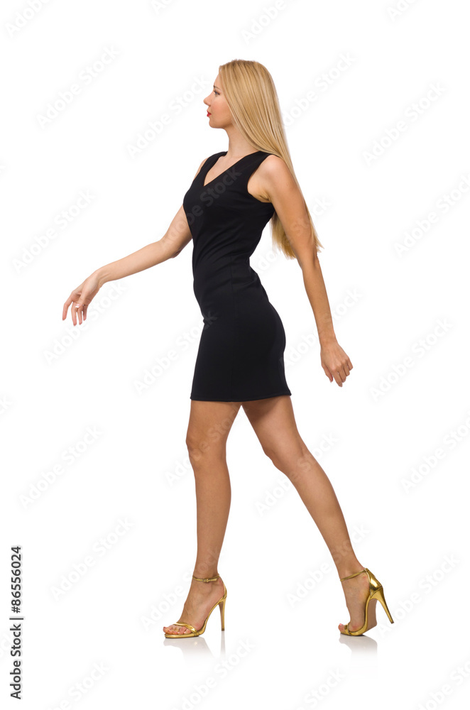 Fototapeta premium Young pretty woman in mini black dress isolated on white