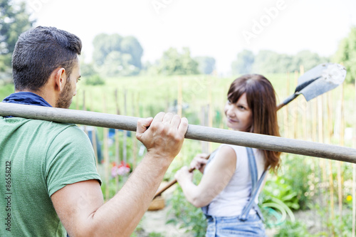 young couple go to work in your garden