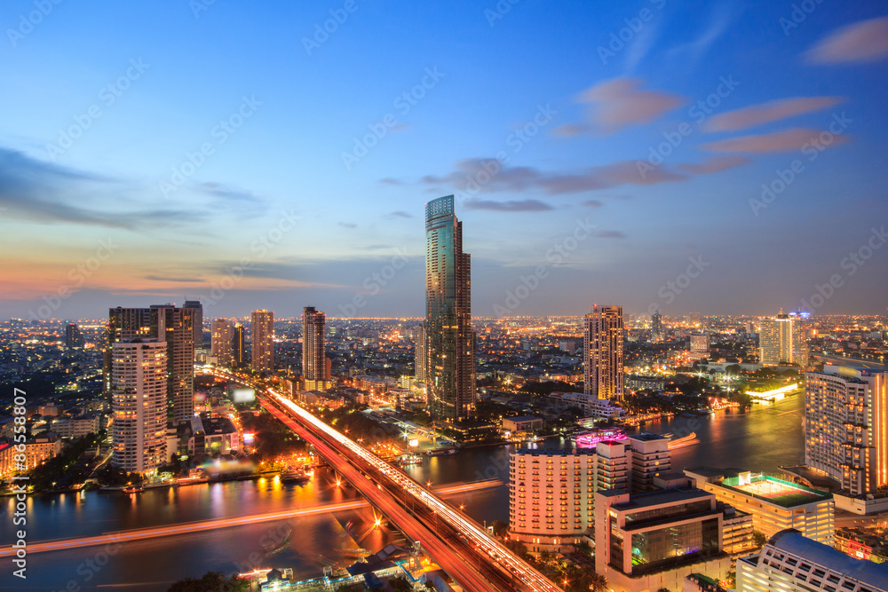 Modern building at riverside in twilight scene at Bangkok, Thailand