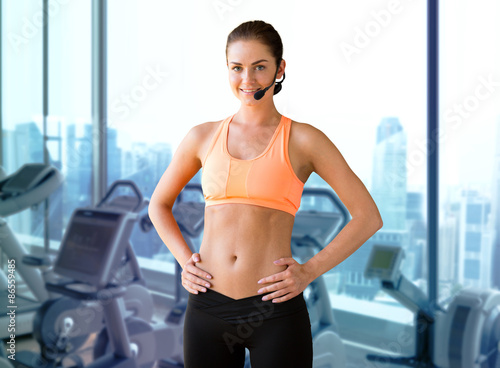 female sports trainer with microphone