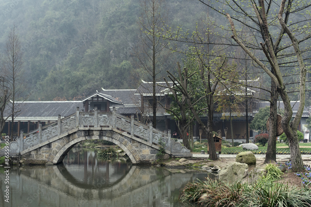 Traditional bridge over water in Zhangjiajie, China
