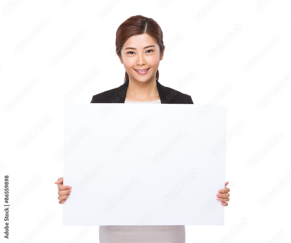 Young businesswoman showing the white banner Young businesswoman showing the white banner