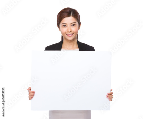 Young businesswoman showing the white banner © leungchopan
