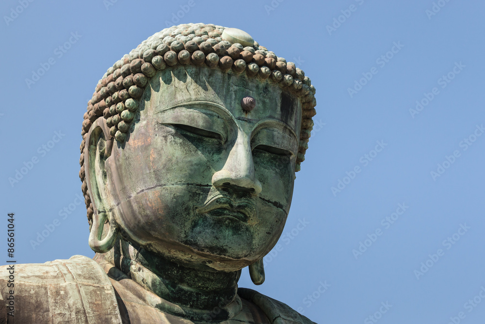 close up of Great Buddha statue in Kamakura