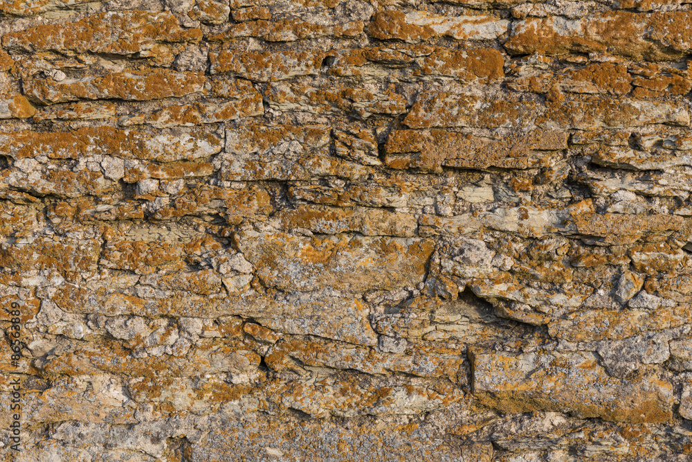 Old stone wall texture with moss Old stone wall texture with moss