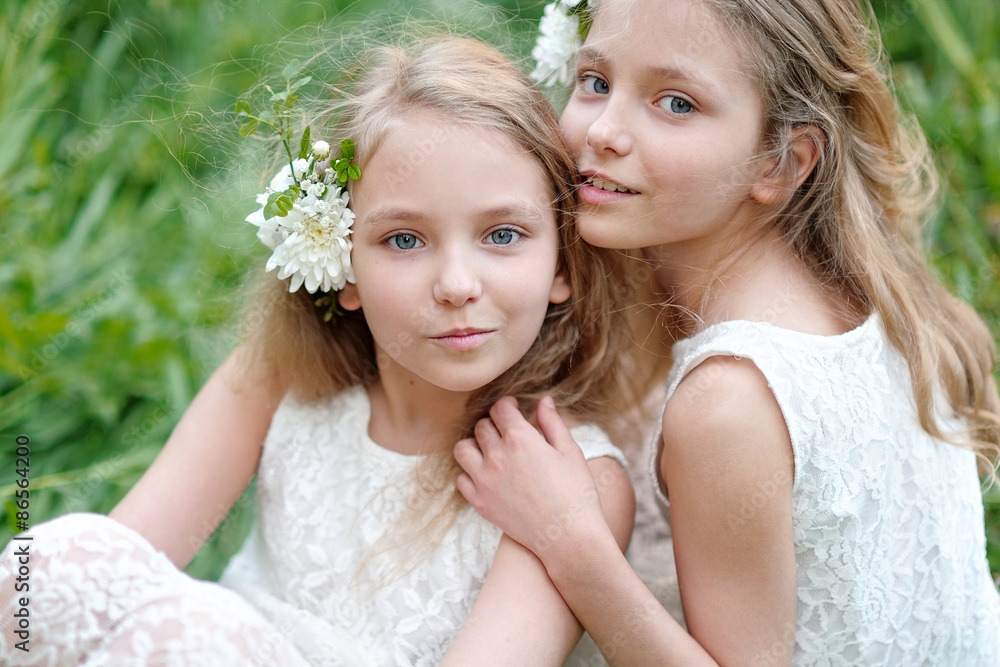 Portrait of two little girls twins