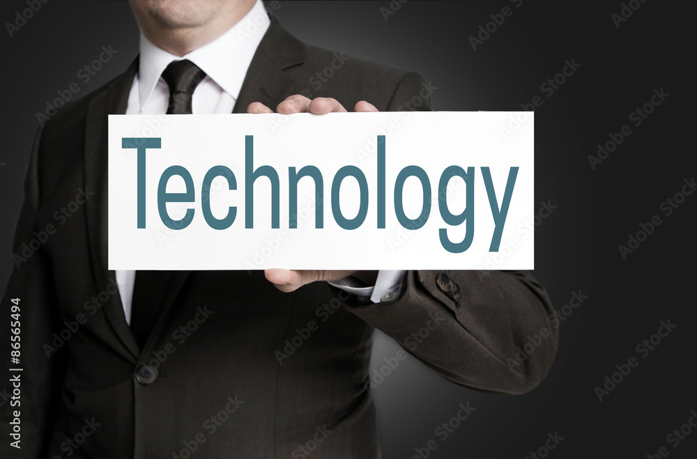 Technology sign is held by businessman Technology sign is held by businessman