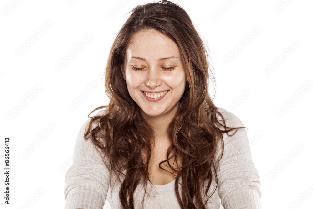 smiling young woman without makeup on a white background smiling young woman without makeup on a white background