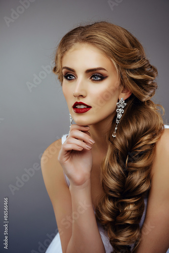 Portrait of Beautiful Woman with Long Blonde Hair, Fashion MakeUp and Red Lips. Close Up