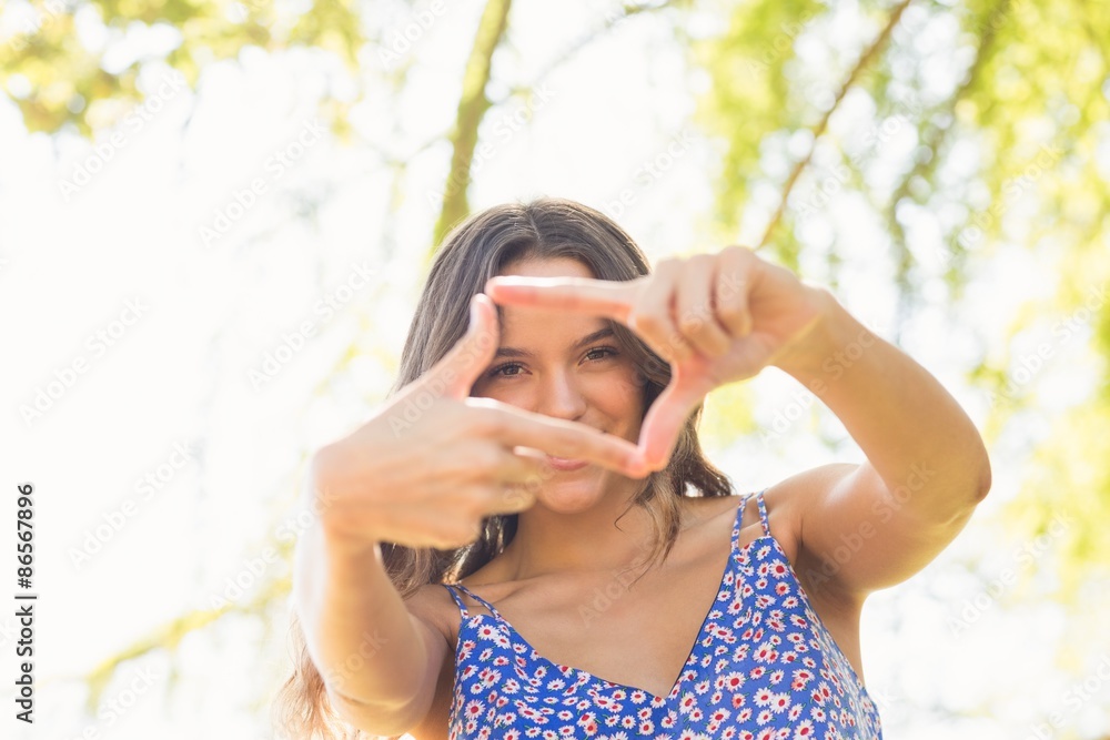 Pretty brunette doing frame with her fingers Pretty brunette doing frame with her fingers