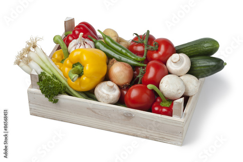 Wooden chest with fresh vegetables