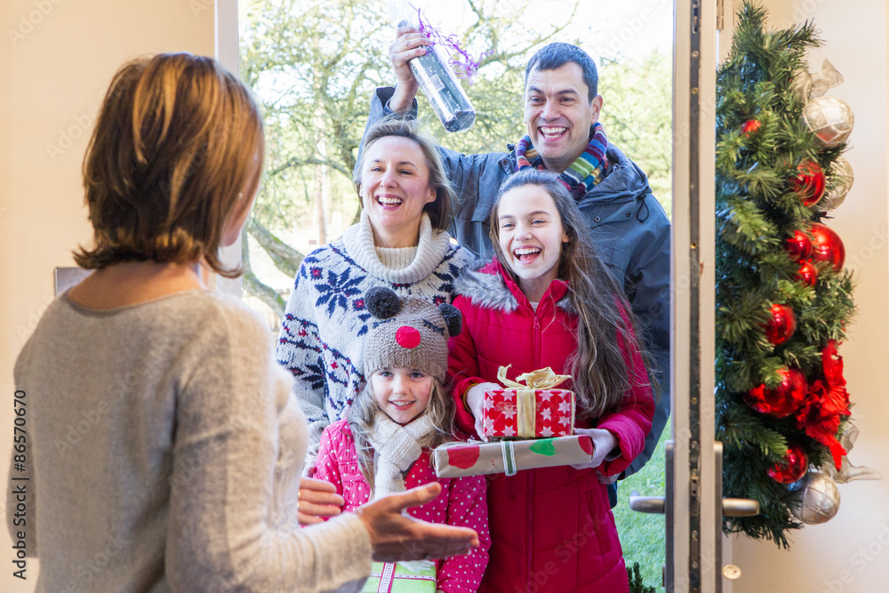 Family delivering presents at Christmas Family delivering presents at Christmas