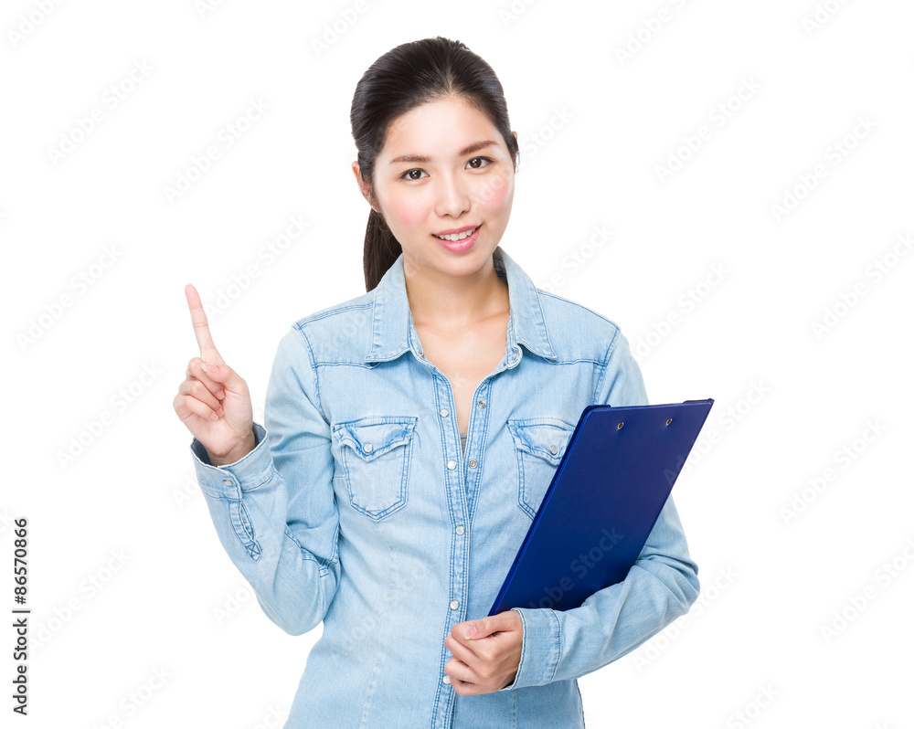 Asian woman holding with file board and finger point up Asian woman holding with file board and finger point up