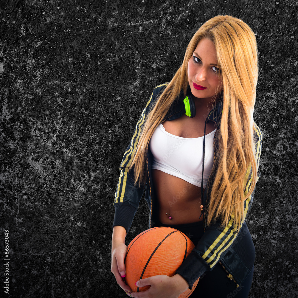 Sexy girl with a basketball foto de Stock | Adobe Stock