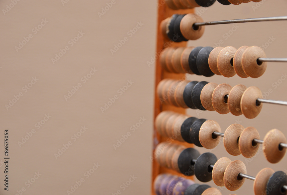 Old wooden abacus on gray background Old wooden abacus on gray background