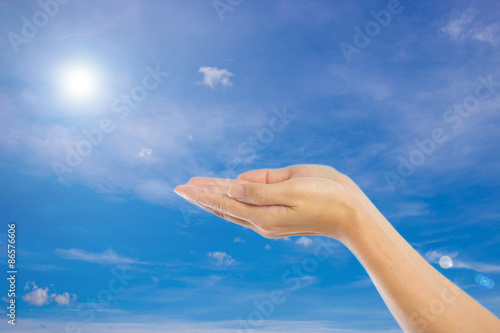 Praying Hands Isolated on sky background.