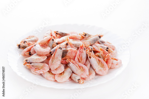 Pile of frozen shrimps on plate