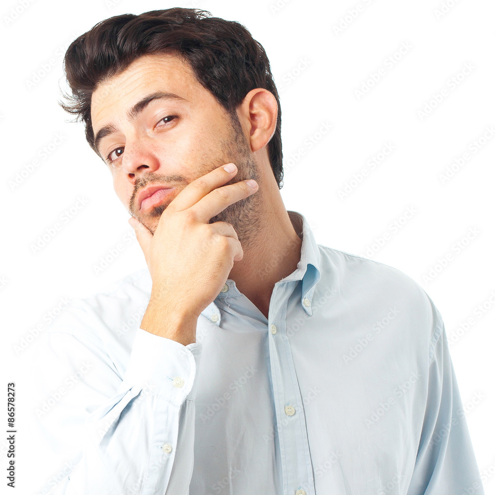 young handsome man with hand on chin imagine gesture on a white young handsome man with hand on chin imagine gesture on a white