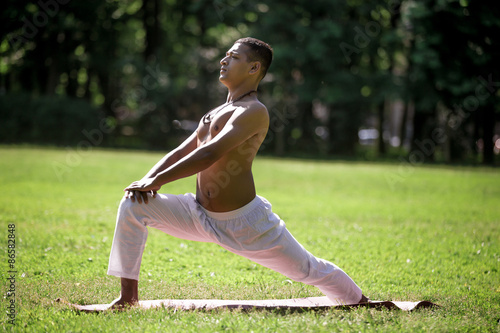 High lunge pose in park photo