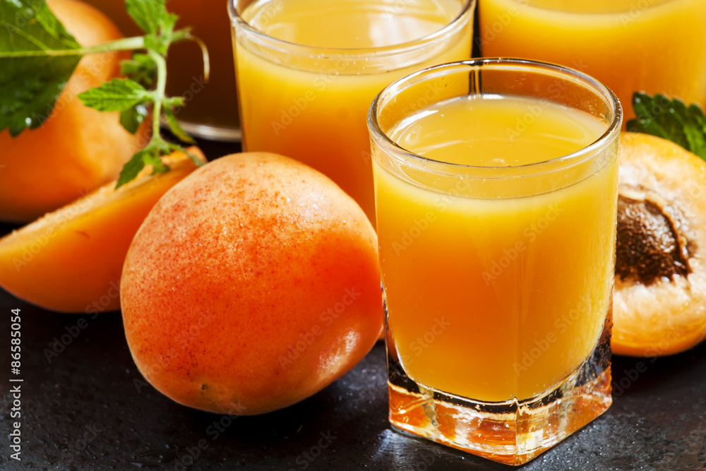 Fresh apricot juice and apricots with mint on black background, Fresh apricot juice and apricots with mint on black background,