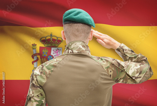 National military forces with flag on background conceptual series - Spain photo