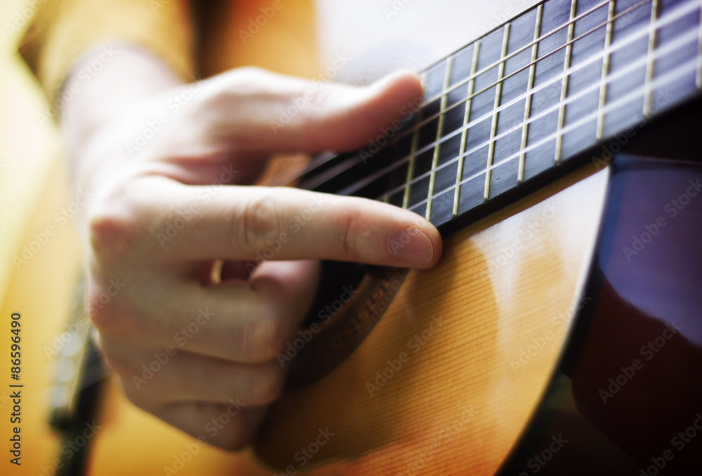 Fototapeta premium Man hand playing on acoustic guitar
