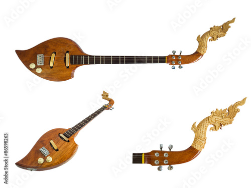 Thai musical instruments, Electric wooden pin with the great Naga head Isolated on white background. Clipping path.