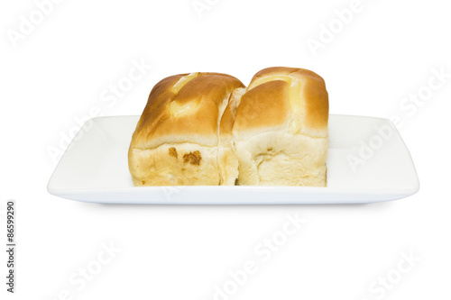 Cream custard filling bread in square white plate on white backg