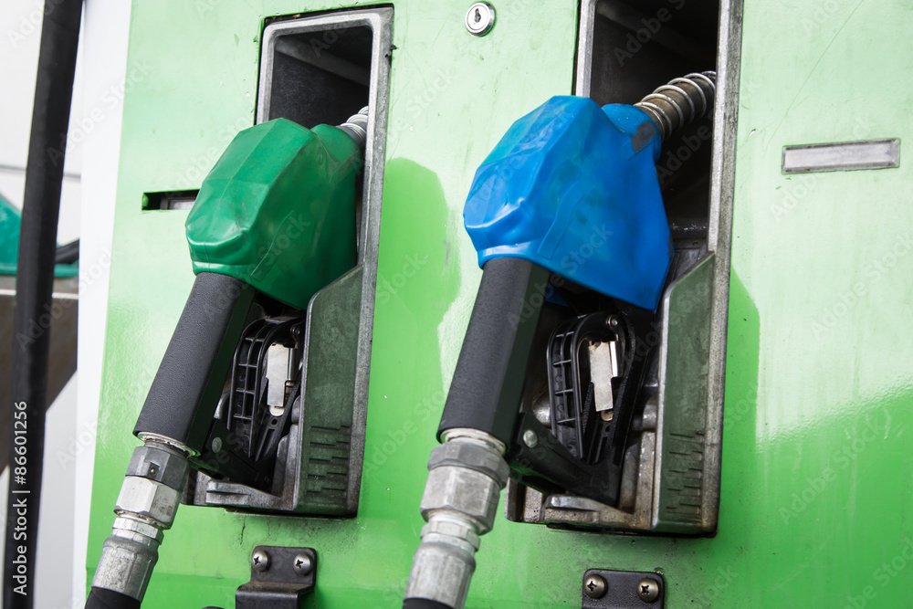 Gas pump nozzles in service station Gas pump nozzles in service station