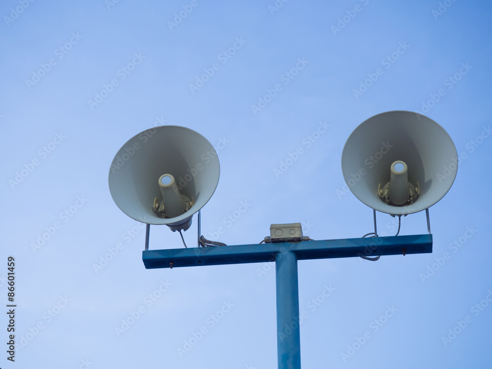 Twin loudspeakers against on blue sky background. Twin loudspeakers against on blue sky background.