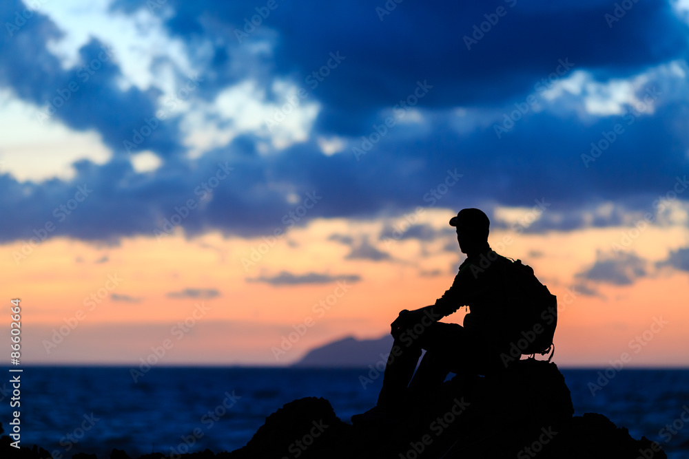 Hiking silhouette backpacker, man trail runner in mountains