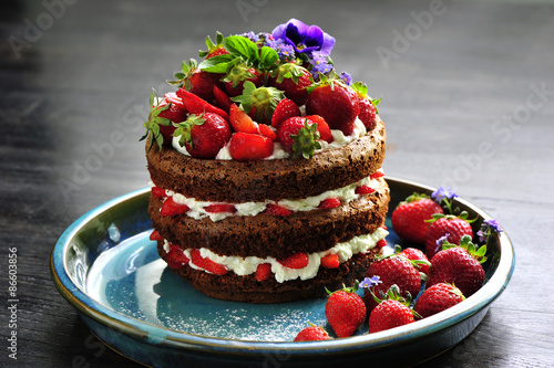 beautiful cake with strawberries and cream photo