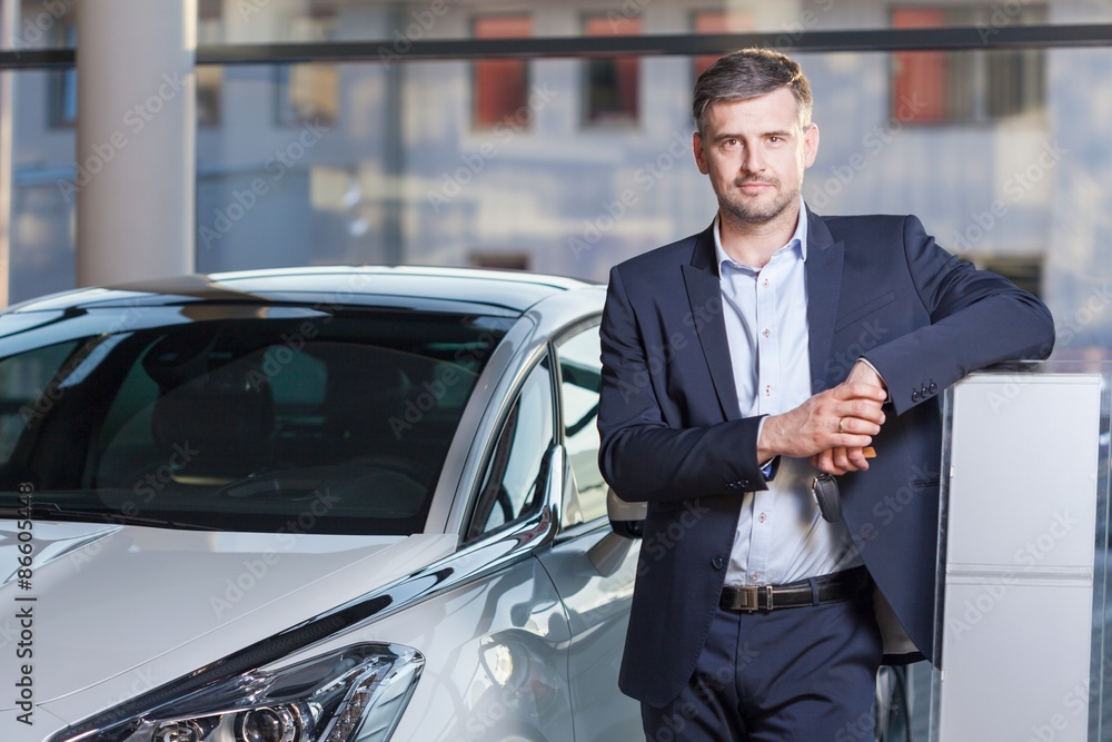 Man standing by new vehicle Man standing by new vehicle