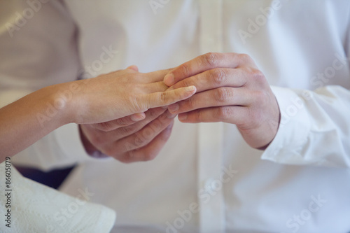  Groom Put the Wedding Ring on bride, close up