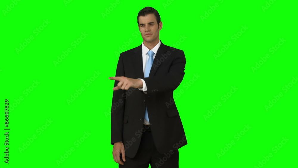 Businessman pointing something with his finger Businessman pointing something with his finger