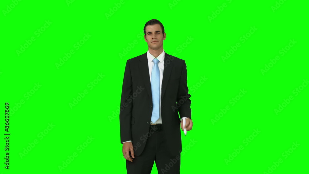 Concentrated businessman pointing with pen Concentrated businessman pointing with pen