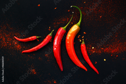 Принти на полотні Chili peppers on a black background